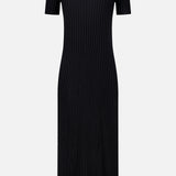 The Isabela Maxi Dress by LISA YANG is a black, ankle-length dress crafted from cotton-cashmere with short sleeves and a crew neckline. It features vertical ribbing that creates a fitted silhouette, combining simplicity with elegance.