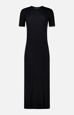 The Isabela Maxi Dress by LISA YANG is a black, ankle-length dress crafted from cotton-cashmere with short sleeves and a crew neckline. It features vertical ribbing that creates a fitted silhouette, combining simplicity with elegance.