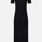 The Isabela Maxi Dress by LISA YANG is a black, ankle-length ribbed knit dress featuring short sleeves and a crew neckline, displayed from the back against a plain white background.