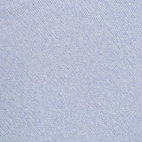 Close-up of the LISA YANG Lova Cashmere and Silk Sweater, featuring a soft, light blue knit with a ribbed collar that reflects a refined Scandinavian aesthetic. A white tag bearing the LISA YANG brand is partially visible at the top left corner.