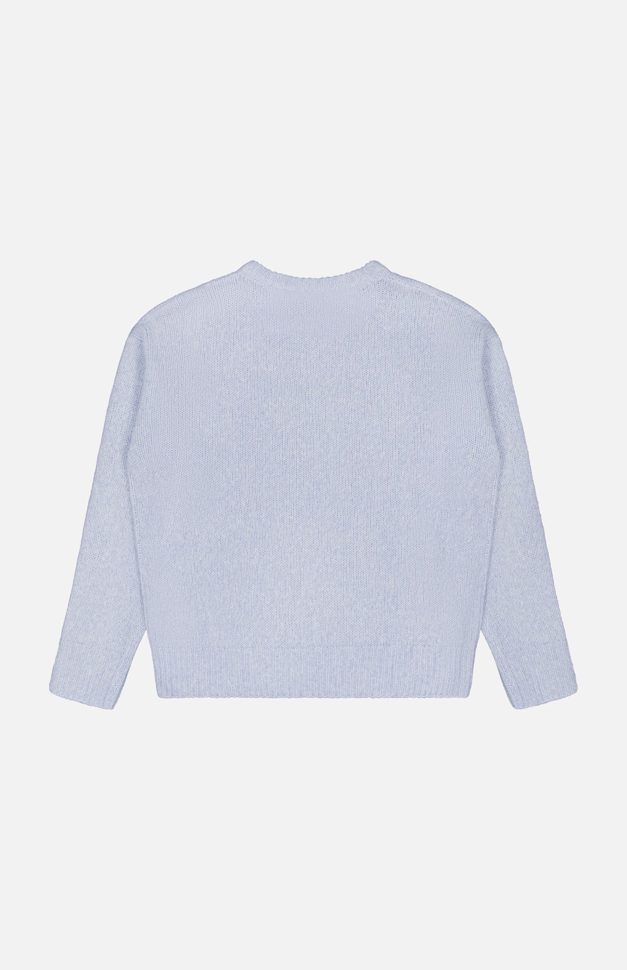 Back view of the LISA YANG Lova Cashmere and Silk Sweater in light blue, with long sleeves, laid flat on a white background to highlight its refined Scandinavian aesthetic.
