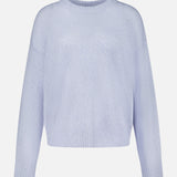 The LISA YANG Lova Cashmere and Silk Sweater in light blue features long sleeves and a crew neckline, showcased against a plain white background. Designed with a relaxed fit, this sweater is finished with ribbed cuffs, hem, and neckline for understated Scandinavian elegance.