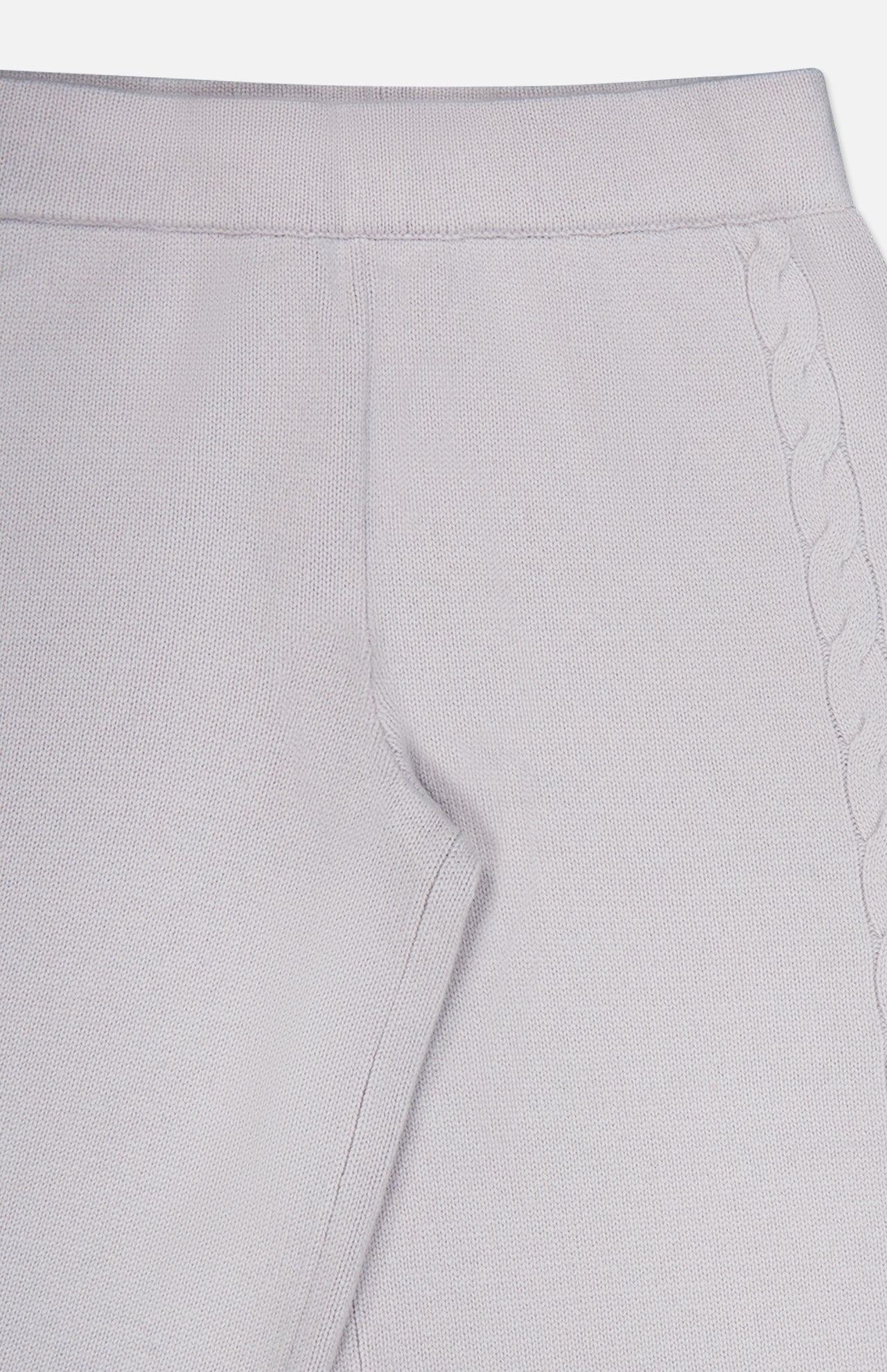 Close-up of the LISA YANG Olanda Cashmere Wide-leg Pant in light gray, highlighting the waistband, seam, and side pocket. A subtle braided knit pattern runs vertically along the side, adding understated detail to this minimalist cashmere design.