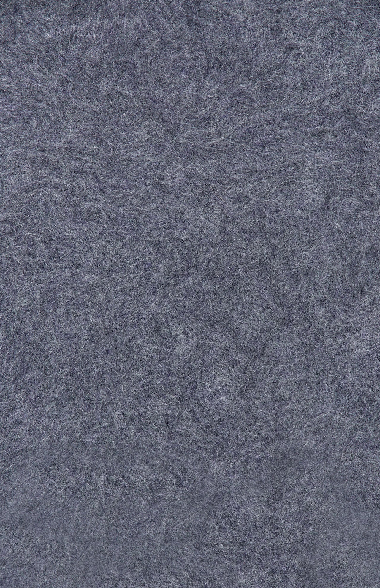 Close-up of the Sandy Brushed Cashmere Sweater by LISA YANG, showcasing its textured, grayish-blue felted surface with visible fibers and a soft, fuzzy finish evocative of premium brushed cashmere.