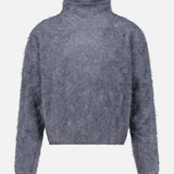 The Sandy Brushed Cashmere Sweater by LISA YANG is a gray, fuzzy long-sleeve knit featuring a mock neck and a slightly cropped fit. Crafted from brushed cashmere, it has a soft, textured appearance and is displayed on a plain white background.