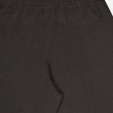 Close-up of the waistband and upper section of the LISA YANG Sofi Cashmere Drawstring Pant in black, highlighting the ribbed elastic waistband and smooth cashmere fabric—a true reflection of Scandinavian aesthetic and slow luxury.