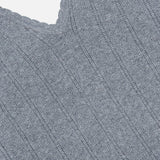 Close-up of the Suni V-neck Tank Top by LISA YANG in a gray, ribbed knit cotton cashmere fabric, featuring a V-shaped neckline and delicate scalloped trim along the edge—beautifully highlighting this refined tank top’s texture and detail against a white background.