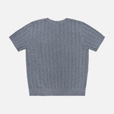 The Suyin T-Shirt by LISA YANG, a short-sleeve light blue cashmere top, is laid flat on a white background to display the back and its all-over ribbed, textured pattern. This lightweight cashmere piece blends comfort and style, making it perfect for effortless layering.