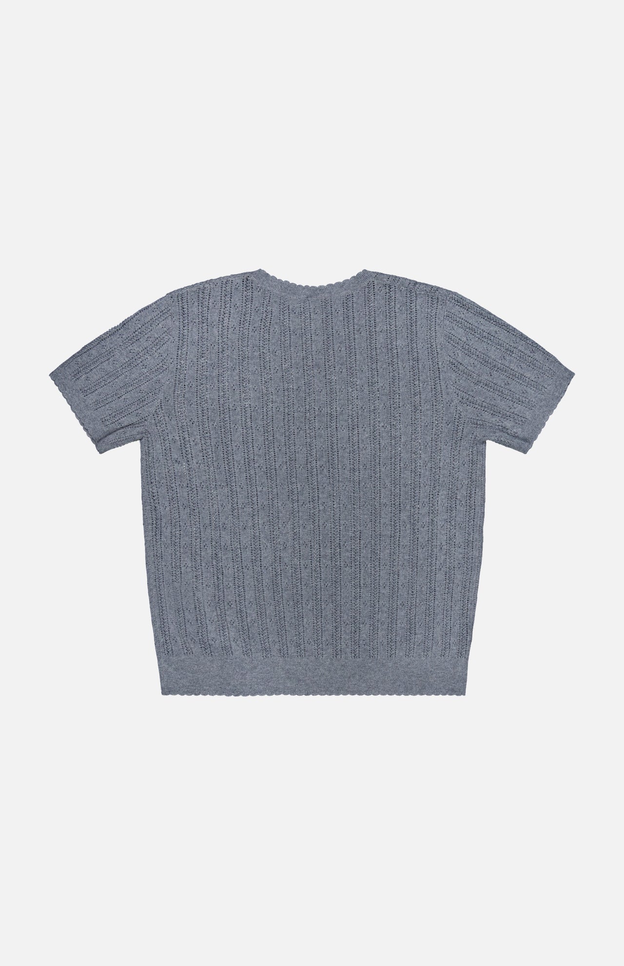 The Suyin T-Shirt by LISA YANG, a short-sleeve light blue cashmere top, is laid flat on a white background to display the back and its all-over ribbed, textured pattern. This lightweight cashmere piece blends comfort and style, making it perfect for effortless layering.
