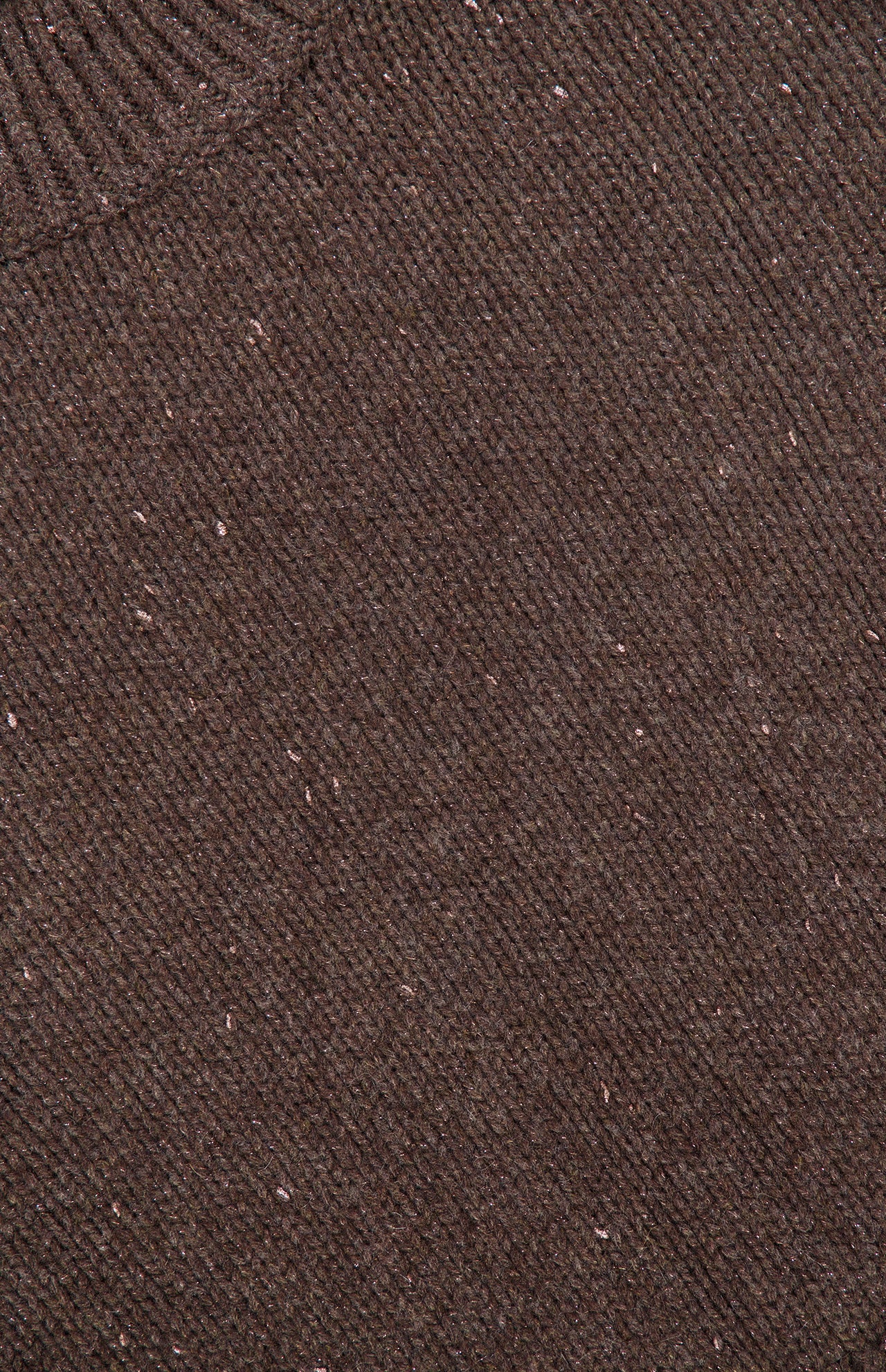 Close-up of the Tarie Sparkle Sweater by LISA YANG, featuring soft brown knit fabric with a ribbed collar accenting the top left corner. The Scandinavian-inspired design highlights its refined texture and scattered lighter specks throughout, embodying the understated elegance of luxury knitwear.