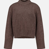 The Tarie Sparkle Sweater by LISA YANG is a brown, long-sleeve, knitted cashmere piece featuring ribbed detailing at the crew neckline, cuffs, and hem. Displayed against a plain white background, this luxurious sweater is an ideal choice for those who admire refined Scandinavian-inspired knitwear.