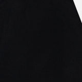 A close-up view of the LISA YANG Torie Flared Cashmere Skirt, highlighting its luxurious knit waistband and upper section in classic black against a white background.
