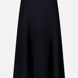 The LISA YANG Torie Flared Cashmere Skirt is shown against a plain white background. This skirt features a sleek, classic silhouette with a smooth texture and a subtly flared hem, highlighting the refined elegance of luxury knitwear.
