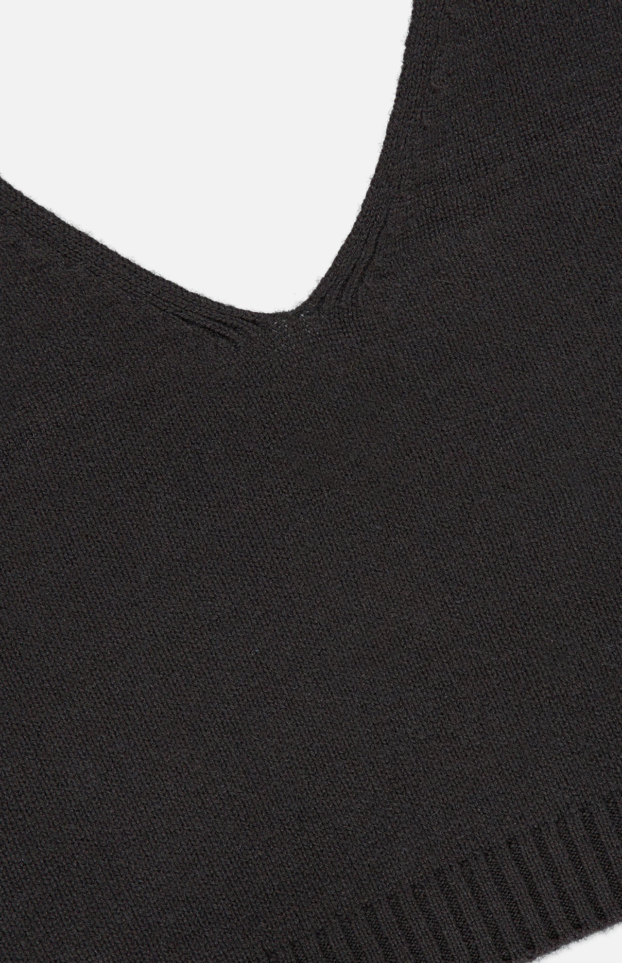 Close-up of the Violia Cashmere Tank Top by LISA YANG in dark brown, highlighting the V-neckline seam and ribbed hem along the bottom edge.