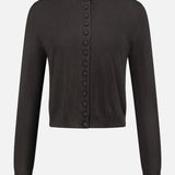 The Wilona Cardigan Sweater by LISA YANG is a black cropped cashmere cardigan with long sleeves and a crew neckline, detailed with a row of matching fabric-covered buttons down the front. Crafted from luxurious cashmere, this simple yet elegant design is finished with ribbed cuffs and hem for a refined touch.