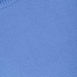 Close-up of the light blue knitted fabric and ribbed collar edge of the Zerlina Turtleneck Sweater by LISA YANG.