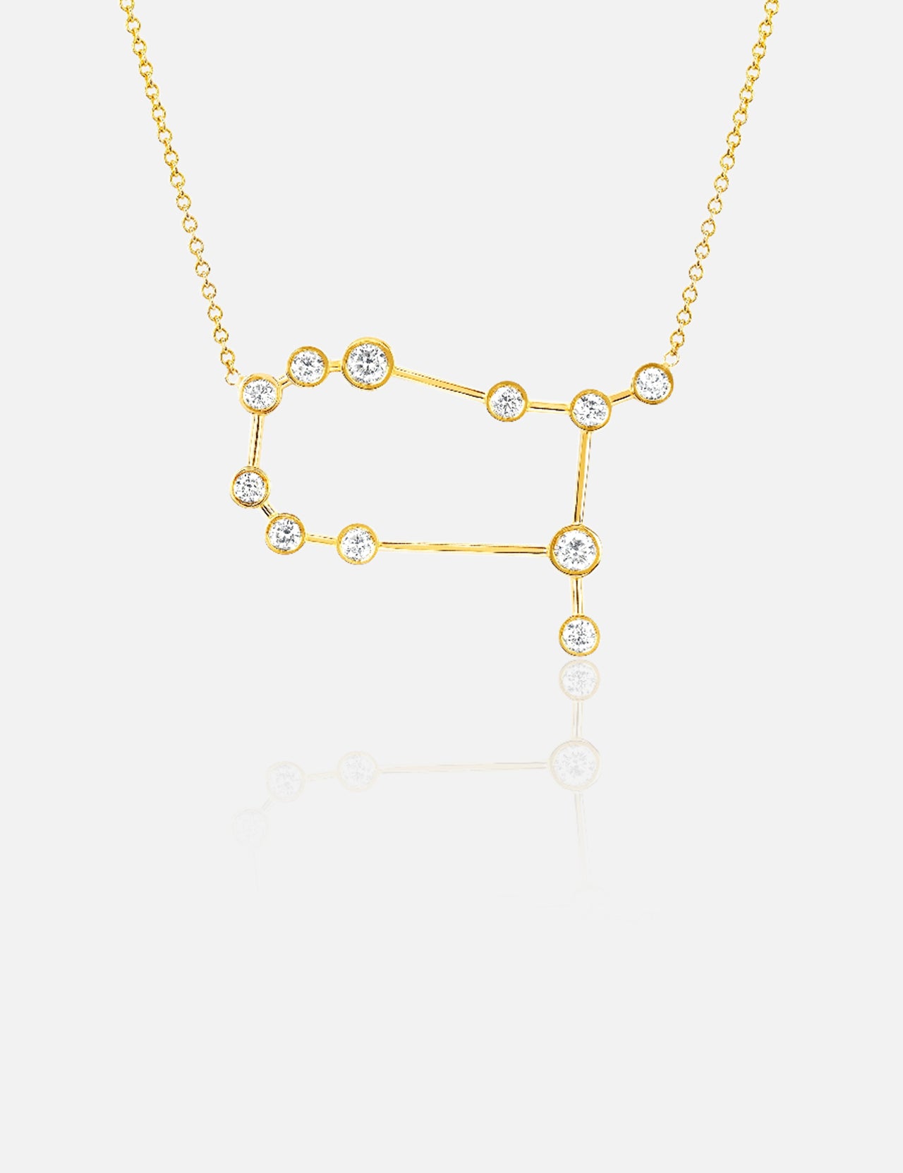 The LOGAN HOLLOWELL Gemini Diamond Constellation Necklace is an elegant yellow gold piece with a constellation-shaped pendant featuring diamond-accented points, displayed on a plain white background.