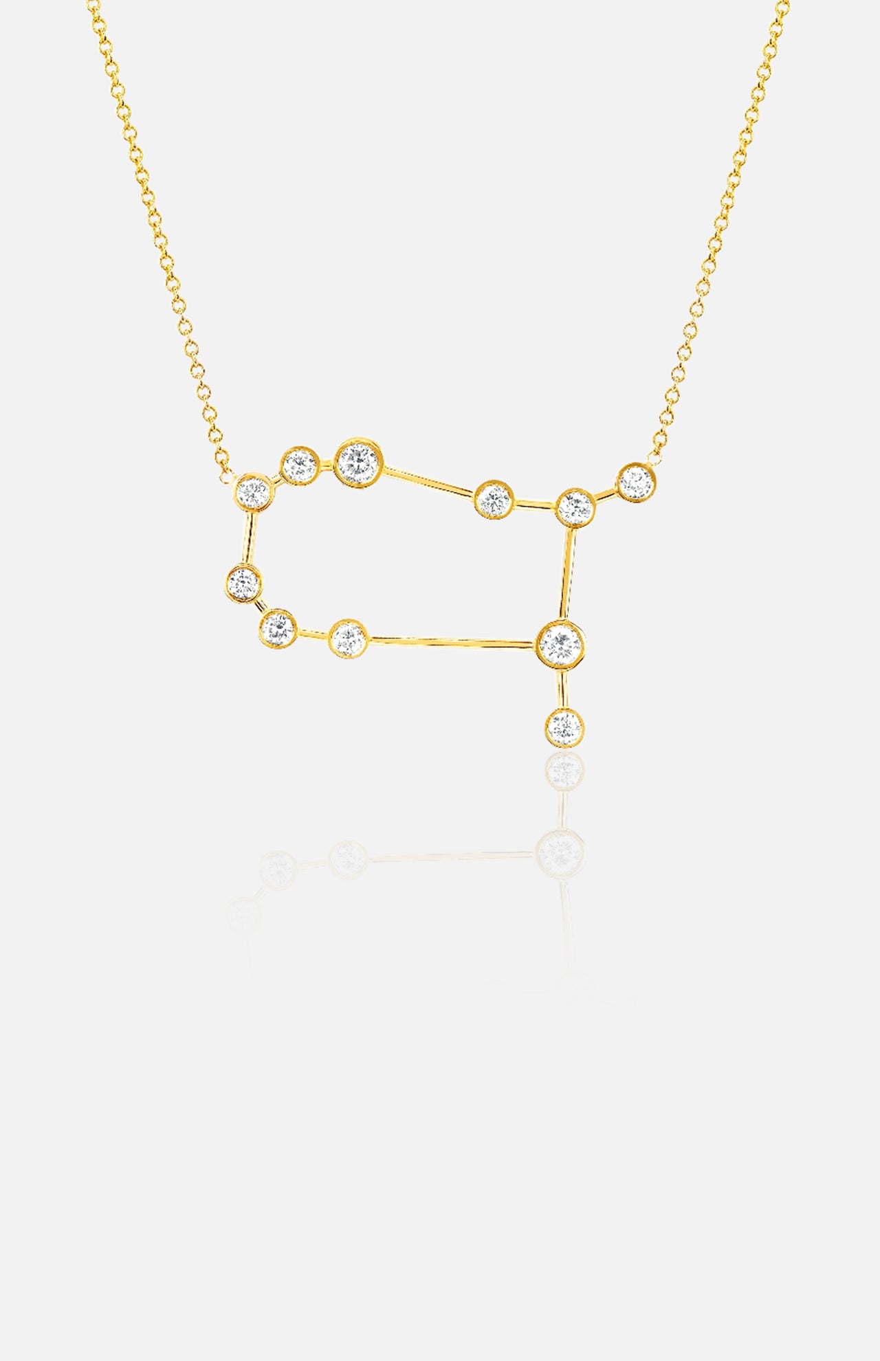 The LOGAN HOLLOWELL Gemini Diamond Constellation Necklace is an elegant yellow gold piece with a constellation-shaped pendant featuring diamond-accented points, displayed on a plain white background.