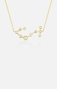 The LOGAN HOLLOWELL Scorpio Diamond Constellation Necklace features a yellow gold pendant with small round diamonds connected by gold links, shown on a white background.