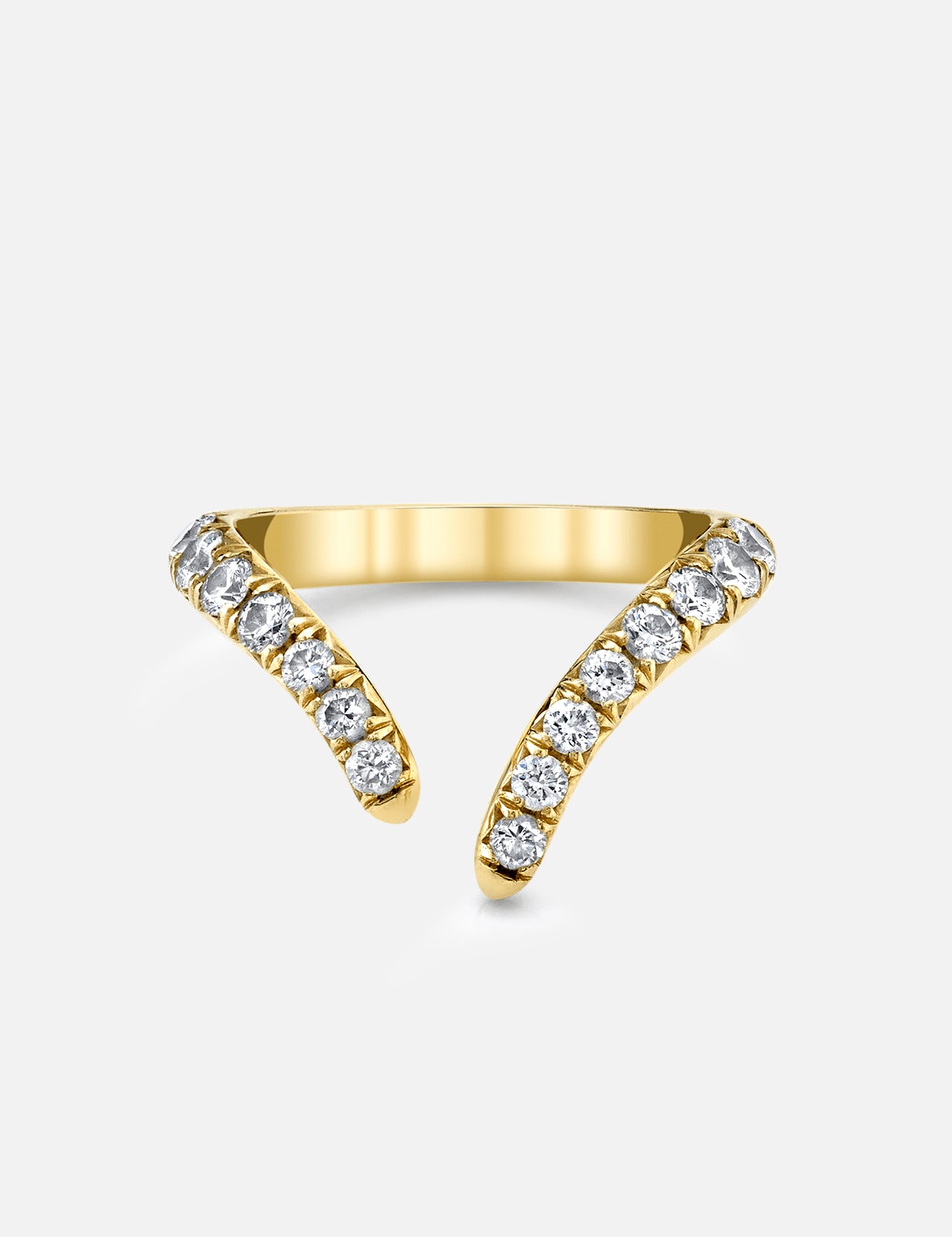 The LOGAN HOLLOWELL French Pave Diamond Tusk Ring is a 14k yellow gold open-front ring with two curved, tusk-like ends, each encrusted with round white diamonds and displayed on a plain light background.