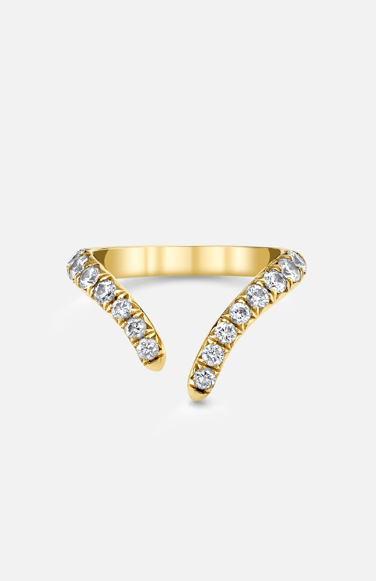 The LOGAN HOLLOWELL French Pave Diamond Tusk Ring is a 14k yellow gold open-front ring with two curved, tusk-like ends, each encrusted with round white diamonds and displayed on a plain light background.