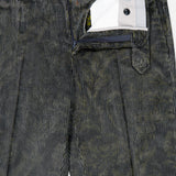 A close-up of Malcom’s Cotton Corduroy Trouser Pant in dark green—a luxury Italian-made piece—featuring a partially visible waistband, zipper, and inner lining with detailed buttons and pocket accents.
