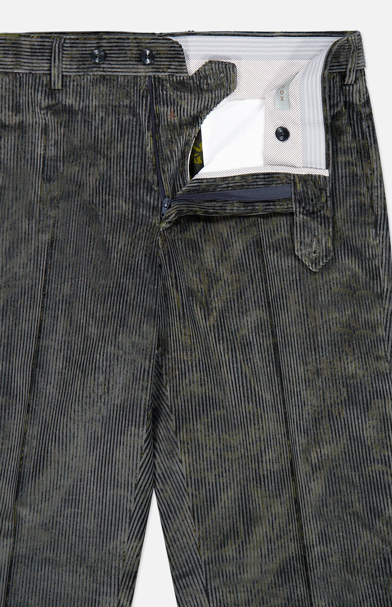 A close-up of Malcom’s Cotton Corduroy Trouser Pant in dark green—a luxury Italian-made piece—featuring a partially visible waistband, zipper, and inner lining with detailed buttons and pocket accents.