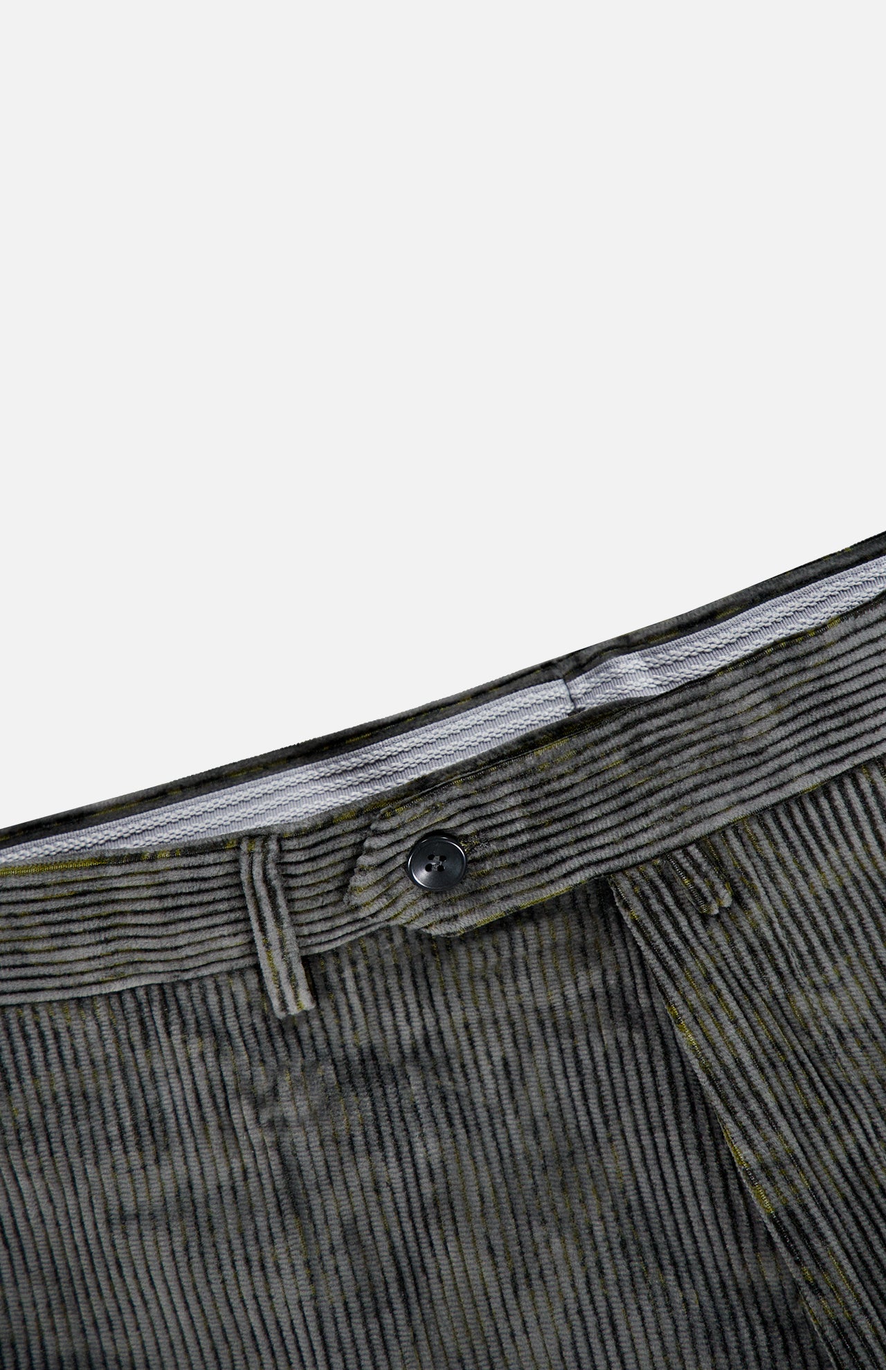 Close-up of the waistband and button of the Malcom Cotton Corduroy Trouser Pant, highlighting refined details against a white background. The black button and visible waistband lining emphasize the craftsmanship of these luxury trousers, expertly made in Italy.