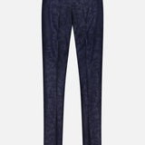 The Malcom Wool Cashmere Camo Trouser Pant is shown from the back against a plain white background. These dark blue luxury trousers feature a subtle camouflage pattern and are expertly crafted in Italy from premium wool cashmere. Designed with belt loops, two buttoned back pockets, and a refined tailored fit.