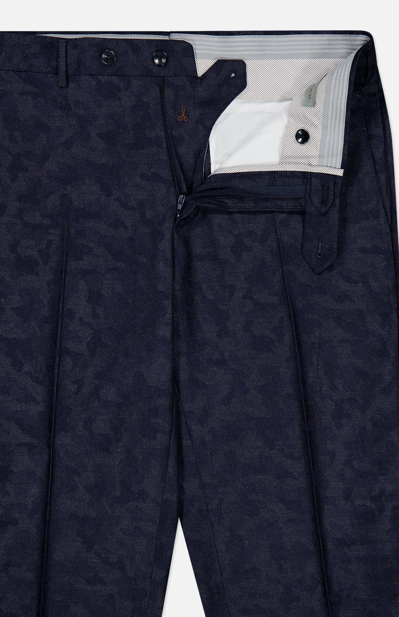 Experience unrivaled comfort and sophistication with the Malcom Wool Cashmere Camo Trouser Pant, expertly crafted in Italy. These dark blue luxury pants feature a subtle camo pattern and are shown partially unzipped and unbuttoned to highlight the detailed waistband, button closure, zipper, and the refined inside lining near the waistband.