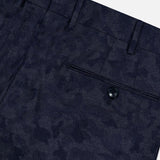 Close-up of Malcom’s Wool Cashmere Camo Trouser Pant in dark blue, featuring a refined camouflage pattern. The expertly crafted Italian design highlights a waistband with belt loops and a single back pocket fastened by a black button, blending sophistication and comfort in luxurious wool-cashmere fabric.