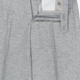 Crafted in Italy, the Malcom Wool Silk Donegal Trouser Pant features a light gray wool-blend with a subtle textured pattern. Shown with the waistband open to reveal the zipper, button, and inner lining details, these luxury trousers offer an elevated look and feel.