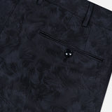 Close-up of the Malcom Wool Stretch Trouser Pant, featuring a subtle leaf pattern with detailed shots of the waistband, belt loops, and a buttoned back pocket.