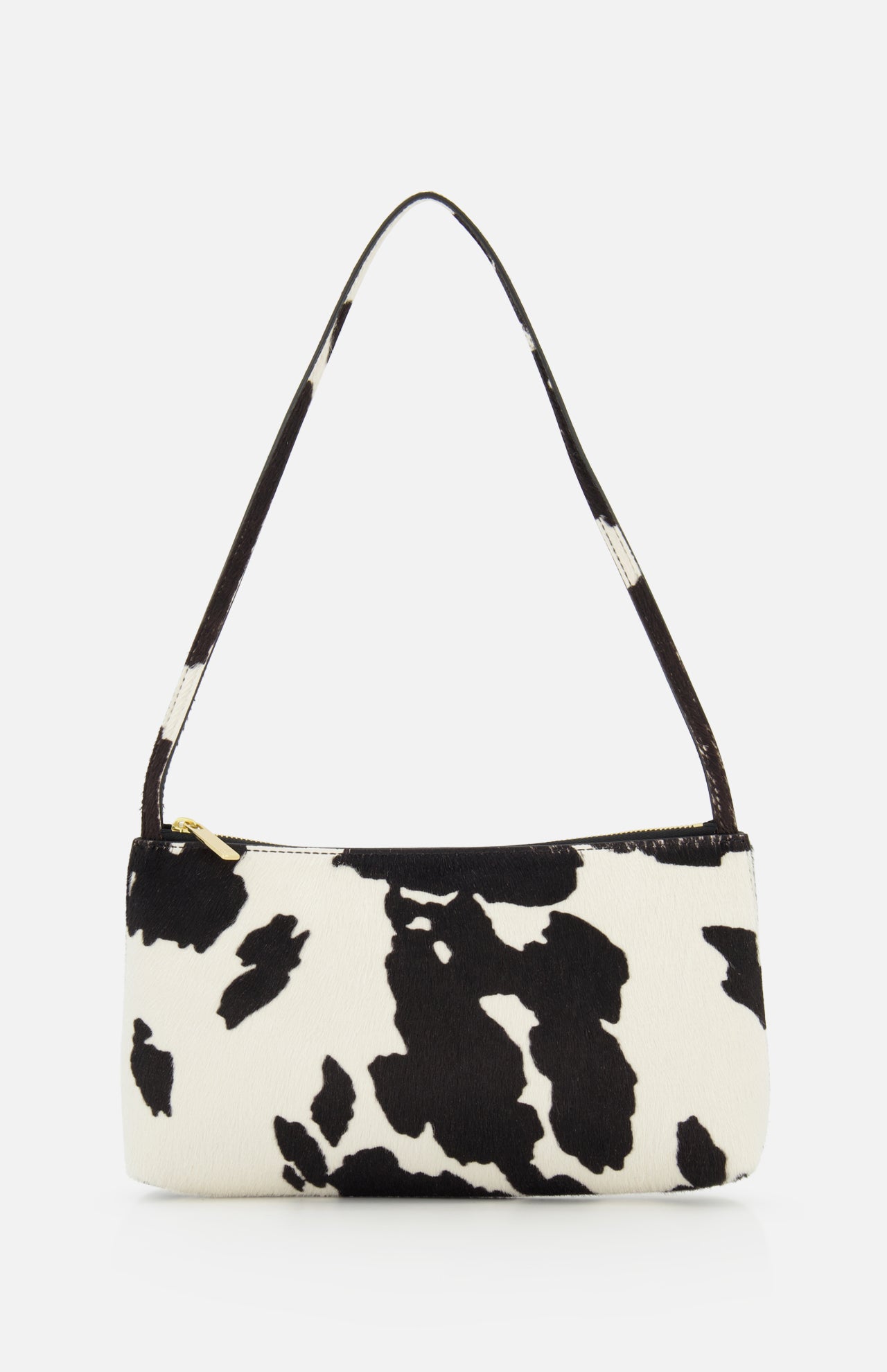 The Gaia Cow Print Shoulder Bag by MANSUR GAVRIEL is a small rectangular black and white handbag with a single strap and bold animal print, shown on a plain white background.