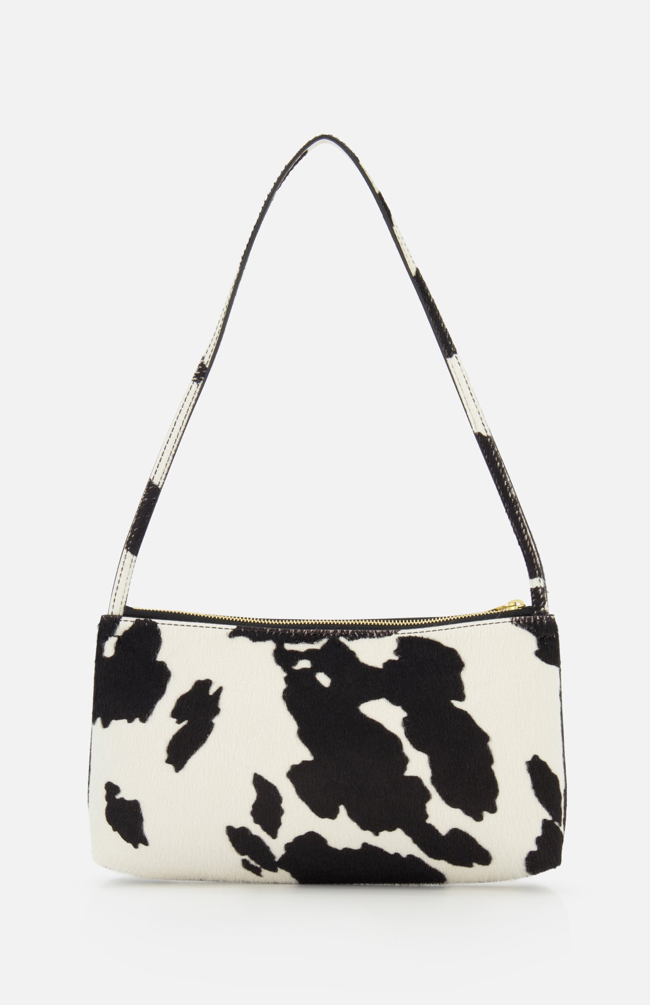 The Gaia Cow Print Shoulder Bag by MANSUR GAVRIEL features a bold black and white cow pattern, a short strap, and a zippered top closure, shown against a plain white background.