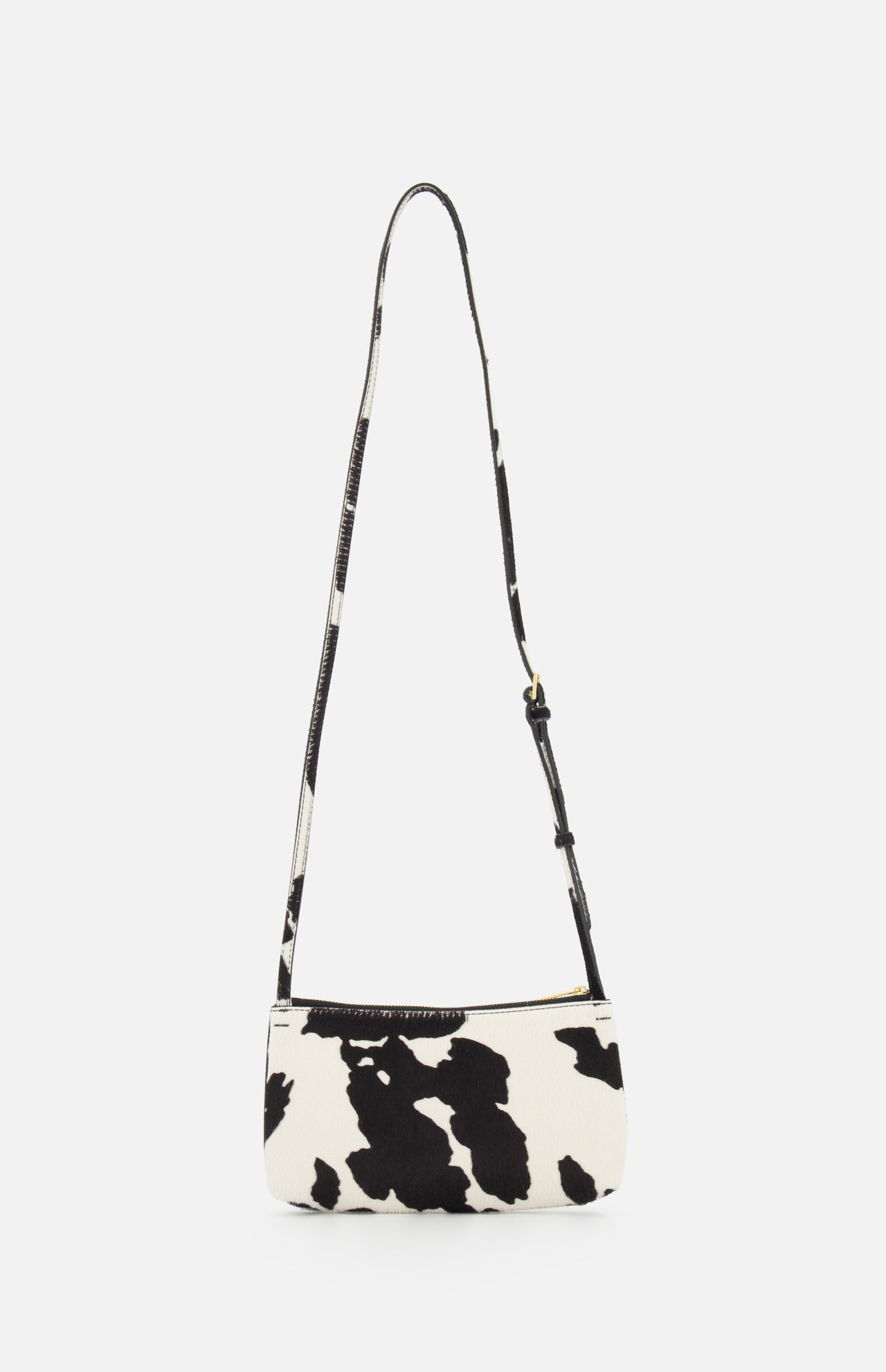 The MANSUR GAVRIEL Mini Gaia Cow Print Crossbody Bag features a black and white pattern, single adjustable strap, and rectangular shape—a stylish mini purse shown against a plain white background.