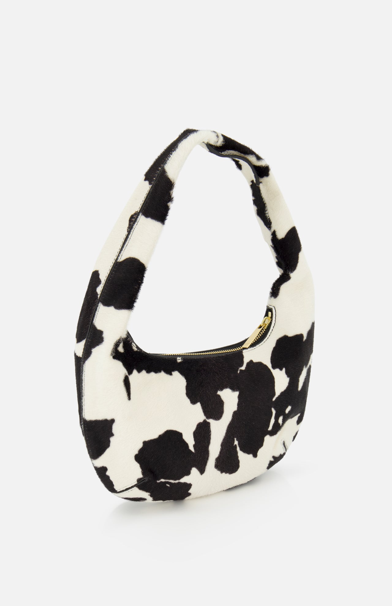 The MANSUR GAVRIEL Mini Gnocchi Cow Print Bag is a small, crescent-shaped hobo with a black and white pattern, zippered top, and single handle.