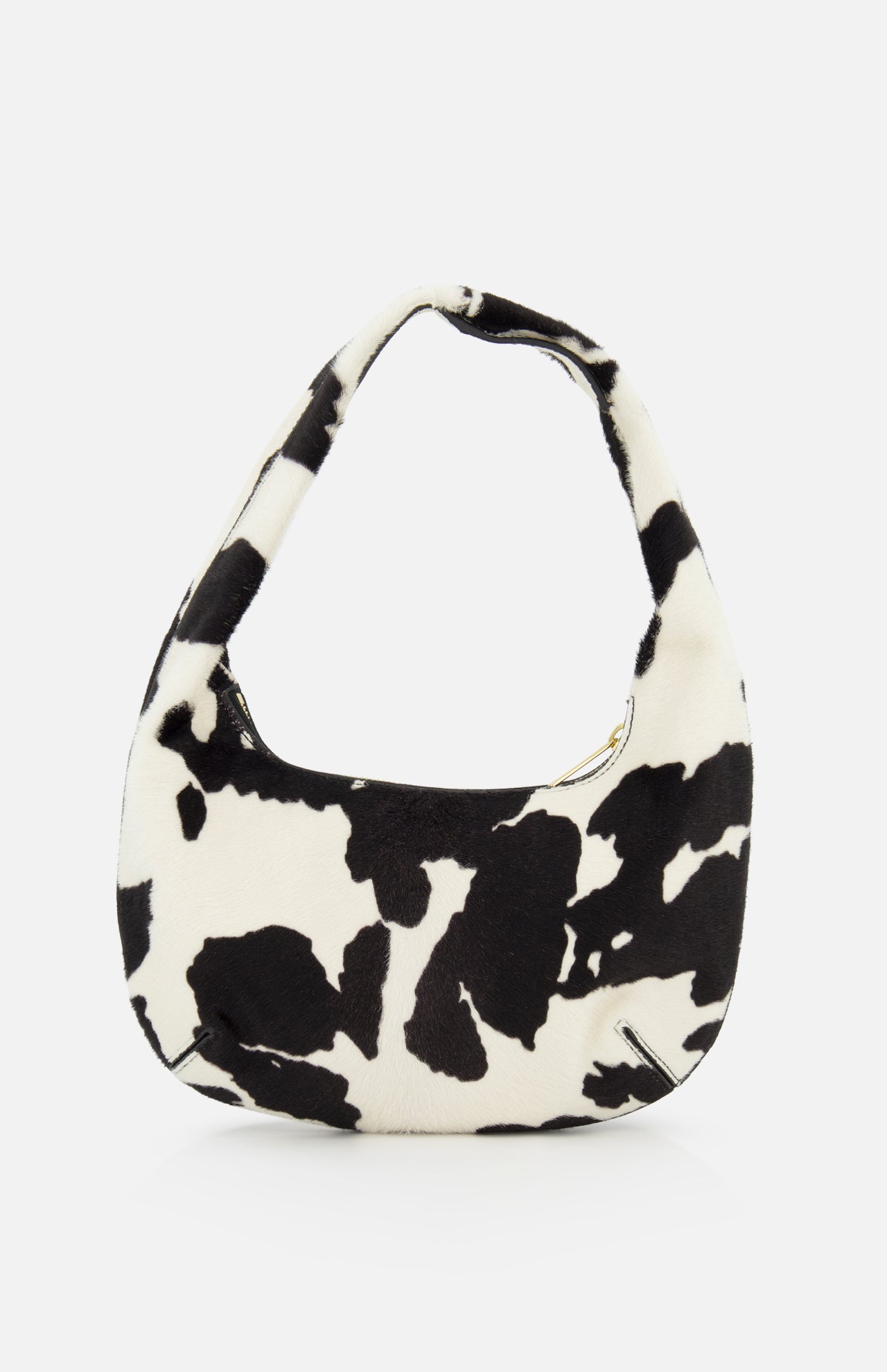 The MANSUR GAVRIEL Mini Gnocchi Cow Print Bag features a black-and-white cow pattern and a curved handle, shown against a plain white background.