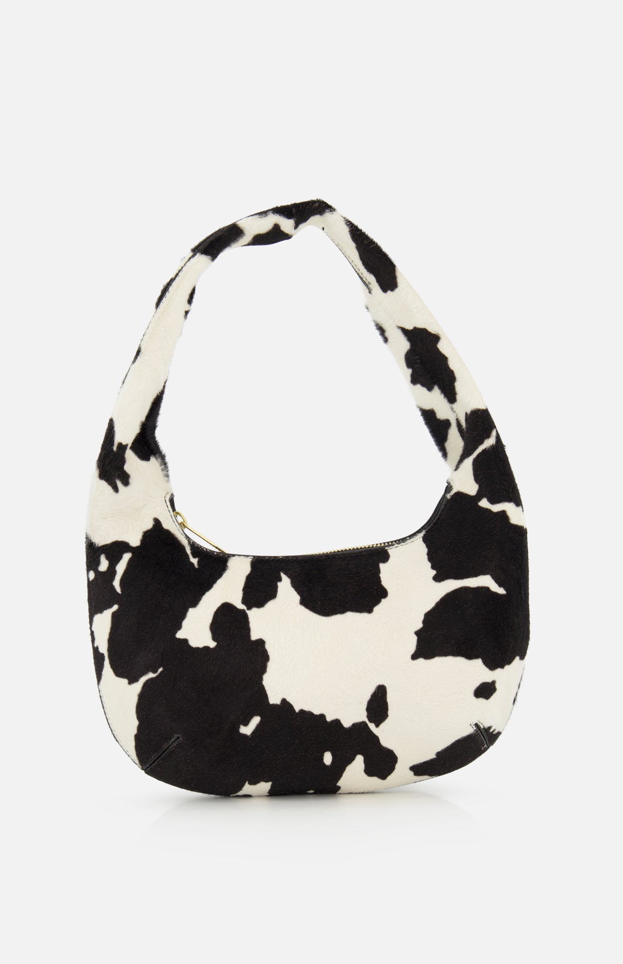 The MANSUR GAVRIEL Mini Gnocchi Cow Print Bag features a black and white animal print, a curved hobo silhouette, and a top zipper closure.