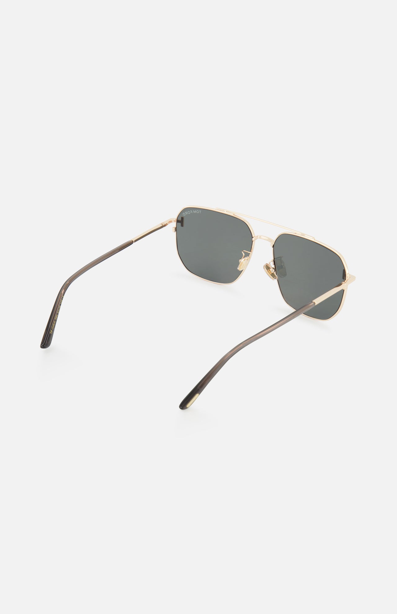 Tom Ford Navigator Gold Sunglasses featuring a gold-frame navigator style with dark lenses and thin temples.