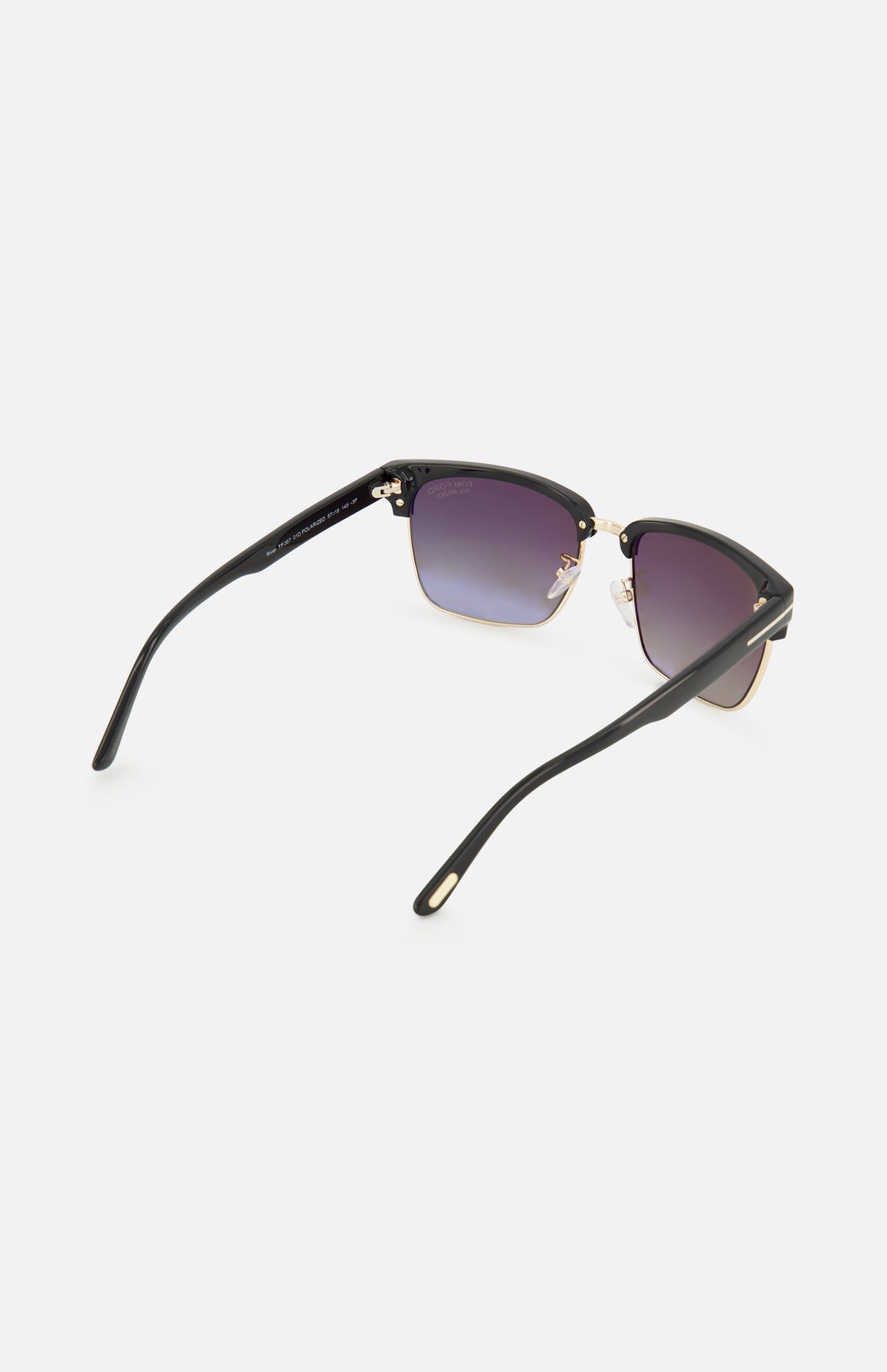 Tom Ford River Geometric Black Sunglasses with a black and gold geometric frame and smoke gradient lenses, viewed from behind.