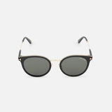 Tom Ford Round Black Sunglasses featuring round black acetate frames with gradient smoke lenses, accented by a thin gold-tone metal bridge and frame details.