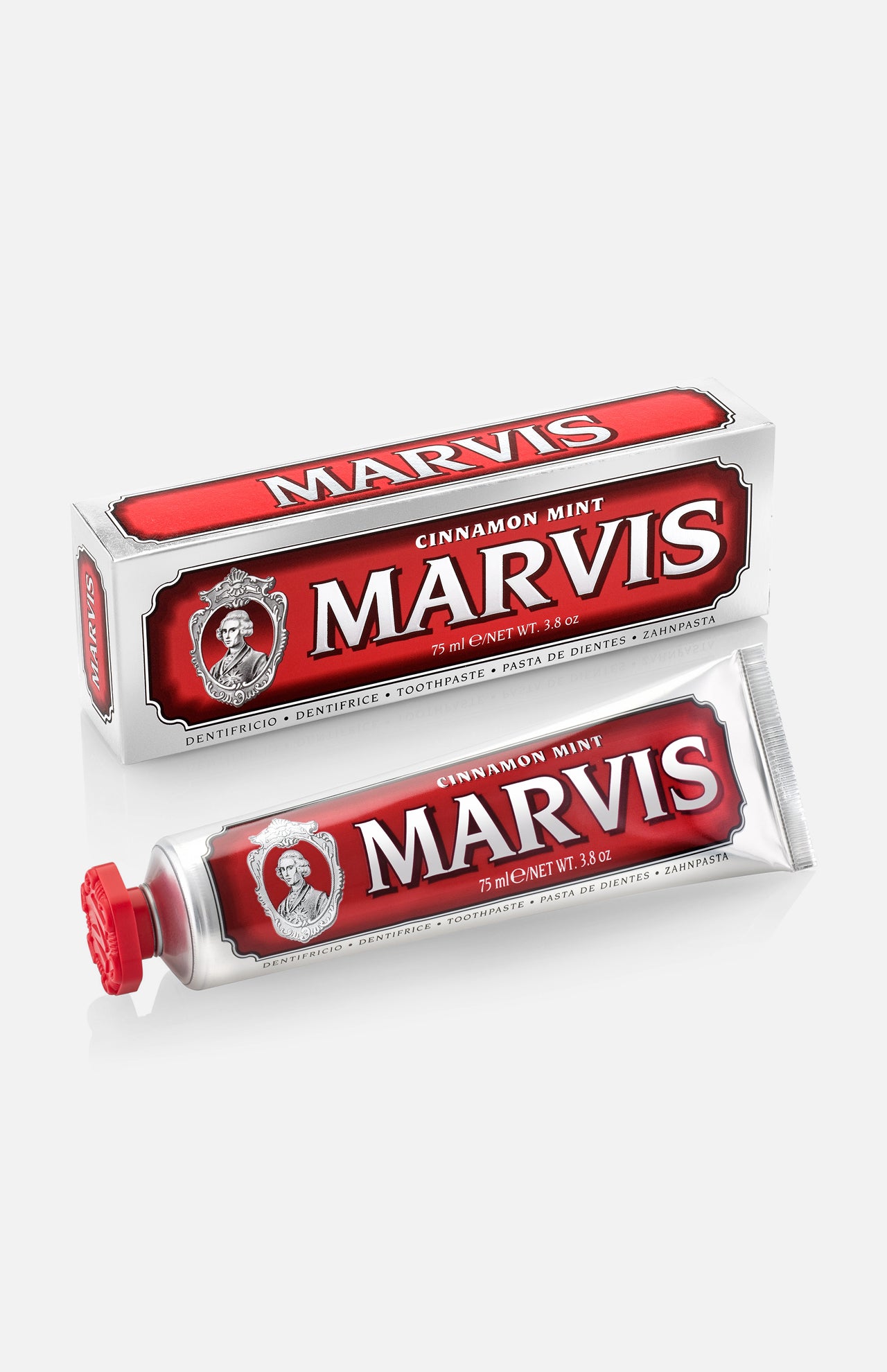 A box and tube of MARVIS Cinnamon Mint Toothpaste are displayed, featuring red and white luxury Italian packaging with bold text and a vintage-style logo that includes a portrait.