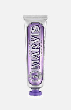 A silver tube of MARVIS Jasmin Mint Toothpaste, crafted in Italy, stands upright against a plain white background, distinguished by its purple accents and matching purple cap.