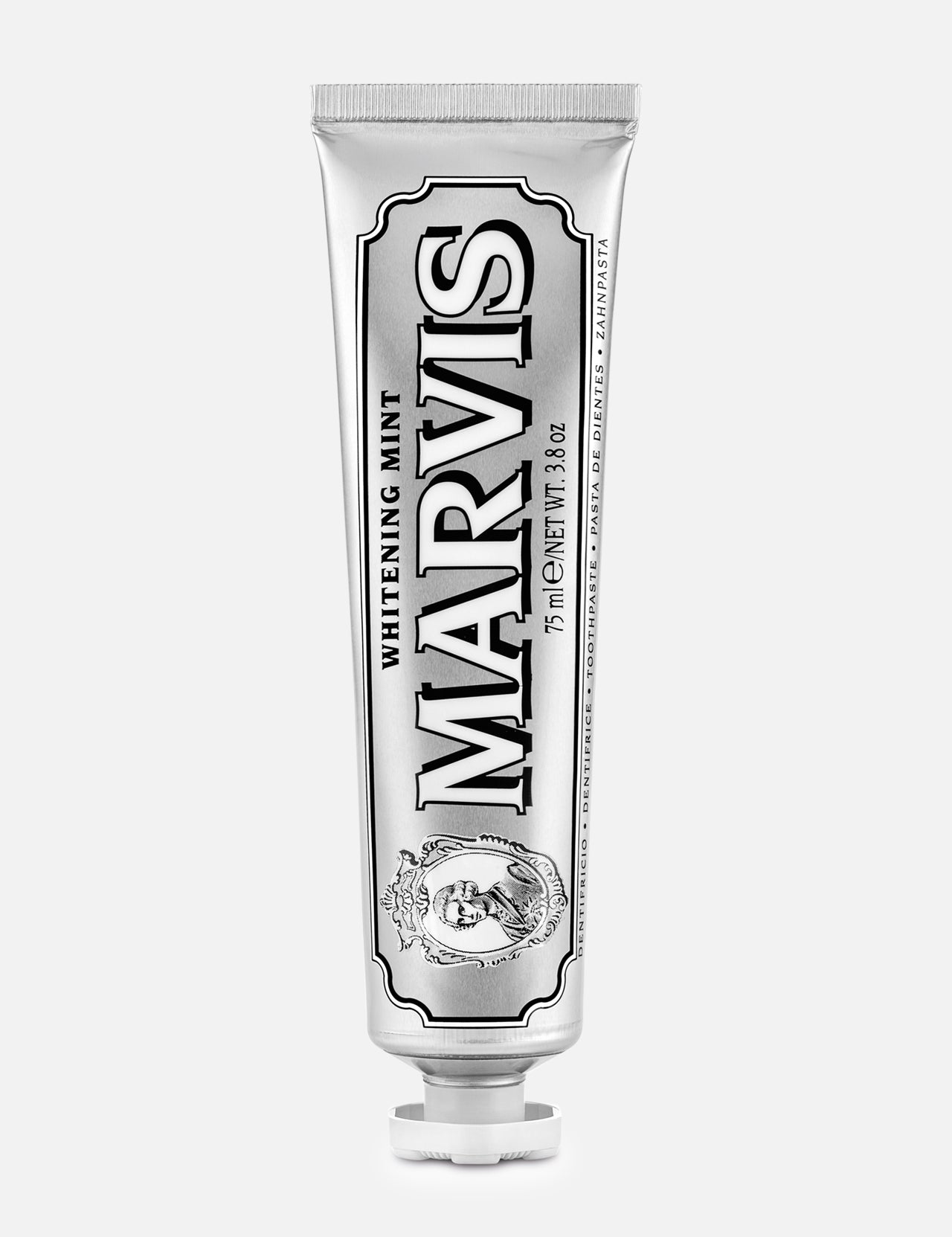 A tube of MARVIS Whitening Mint Toothpaste stands upright on a white background. This Italian-made toothpaste comes in a metallic silver tube adorned with black and white text and decorative details, providing an elegant solution for teeth whitening.