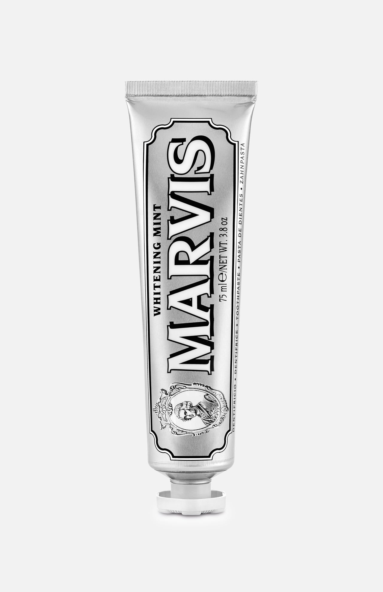 A tube of MARVIS Whitening Mint Toothpaste stands upright on a white background. This Italian-made toothpaste comes in a metallic silver tube adorned with black and white text and decorative details, providing an elegant solution for teeth whitening.