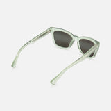 MAUI JIM Hiwahiwa Butterfly Green Sunglasses feature square polarized dark lenses and translucent light green frames, shown on a white background at an angle revealing both front and side views.