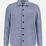 The MAURIZIO BALDASSARI Classic Pockets Plaid Overshirt is a long-sleeve, button-up jacket showcasing a blue and white micro houndstooth plaid pattern. Crafted from a premium hemp wool blend, it features black buttons and a classic collar, displayed against a white background.