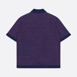 The MAURIZIO BALDASSARI Light Bicolor Johnny Collar Polo Shirt is a short-sleeved, dark purple linen-blend top with navy trim, shown from the back on a light background. Made in Italy.