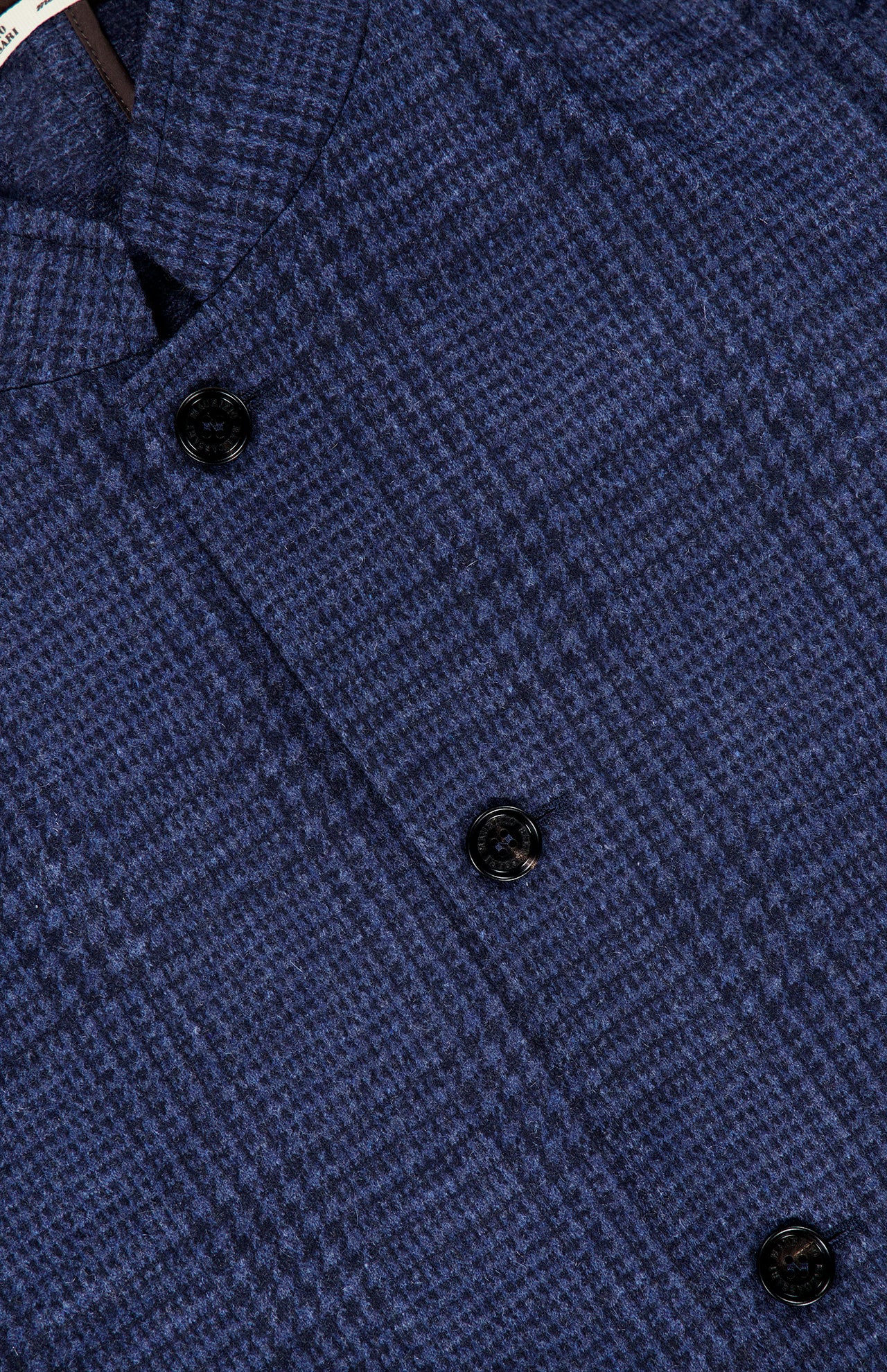 Close-up of the MAURIZIO BALDASSARI Stendhal Stand Collar 4 Button Jacket, showcasing its blue plaid patterned fabric and stand collar design.